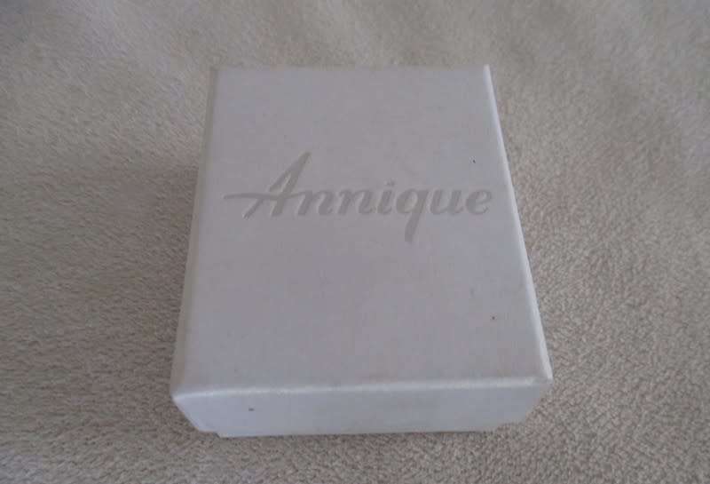 A pair of pretty Annique enamelled clip on earrings in original box