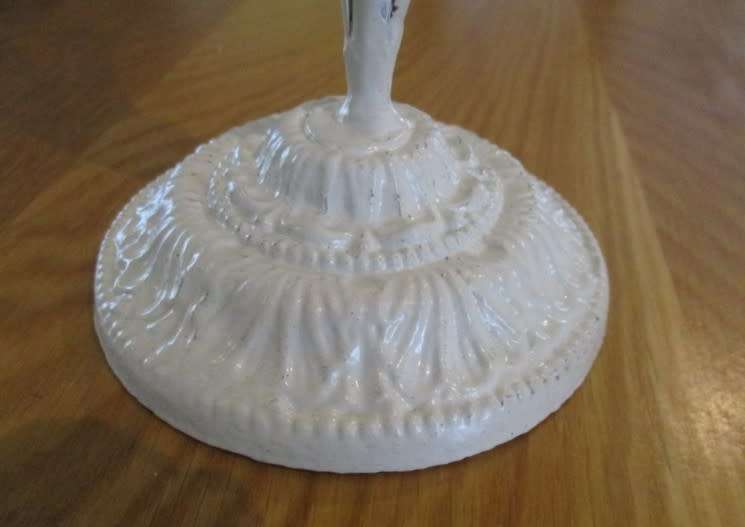Tall painted metal candle holder with lovely floral detail