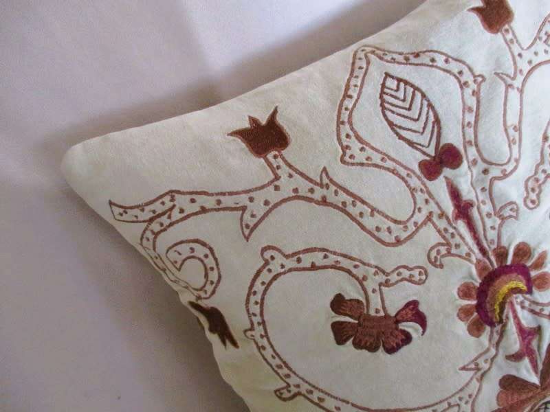 A beautifully embroidered velvet and satin cushion