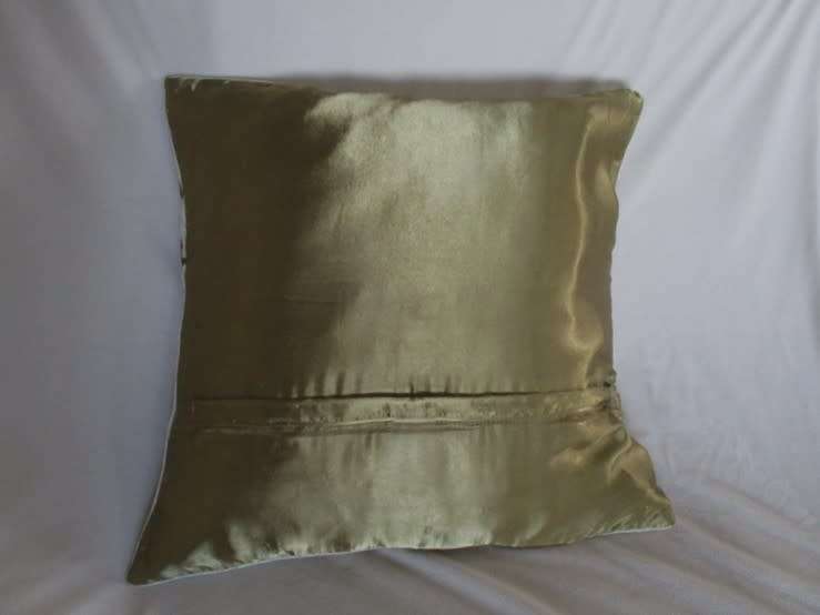 A beautifully embroidered velvet and satin cushion
