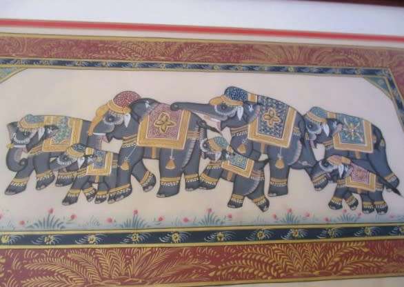 Hand painted Indian artwork - solid wood frame - row of decorative elephants with gilt highlights