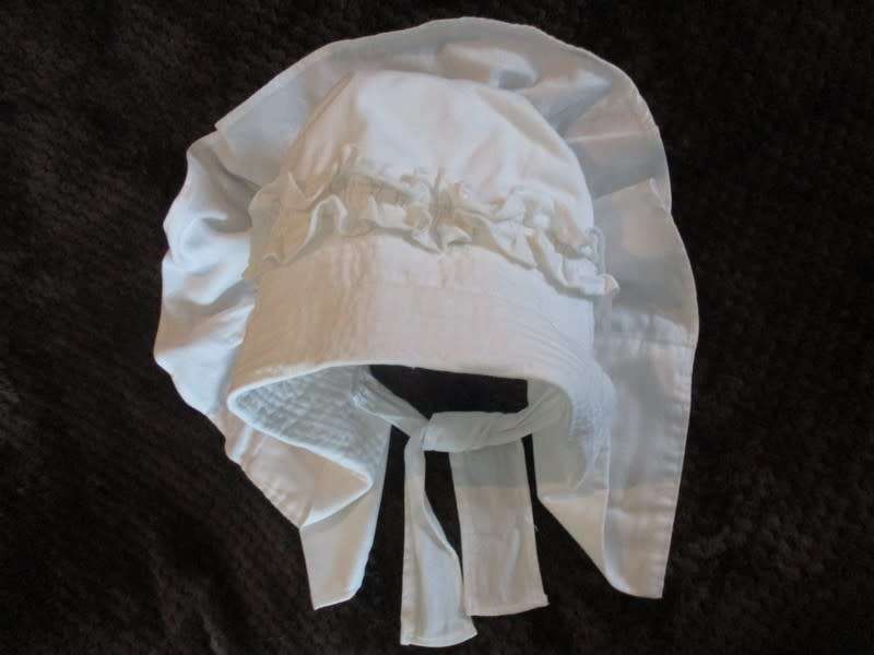 An unusual find - a Voortrekker/Volkspele `kappie` to display (or wear in the garden on a hot day)