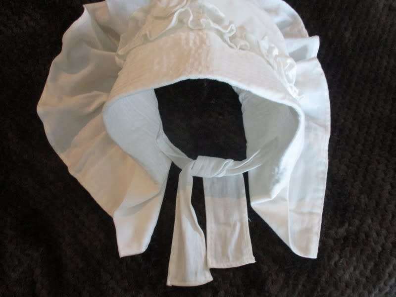 An unusual find - a Voortrekker/Volkspele `kappie` to display (or wear in the garden on a hot day)