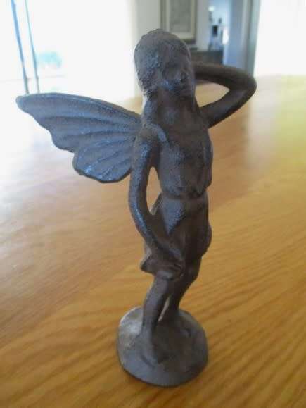 A whimsical cast iron fairy for your patio or garden