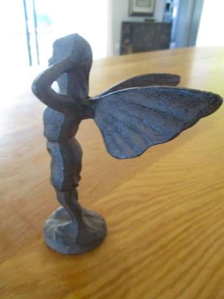 A whimsical cast iron fairy for your patio or garden