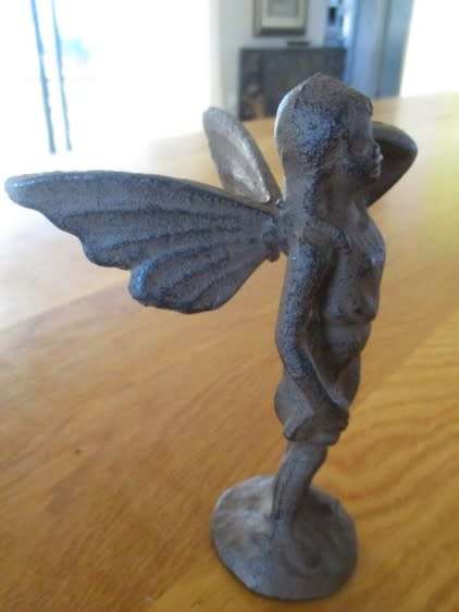 A whimsical cast iron fairy for your patio or garden