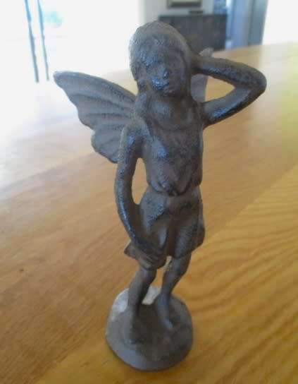 A whimsical cast iron fairy for your patio or garden