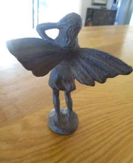 A whimsical cast iron fairy for your patio or garden