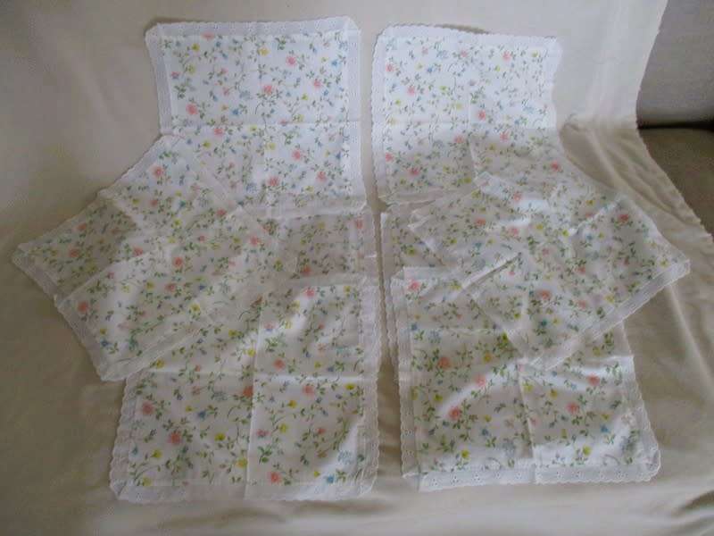 Eight pretty Laura Ashley-like floral cloths with lace borders