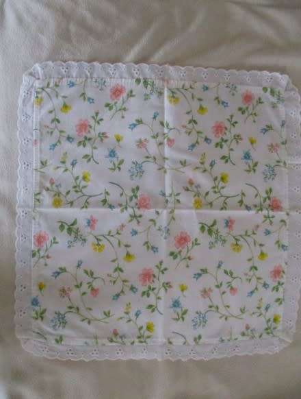Eight pretty Laura Ashley-like floral cloths with lace borders