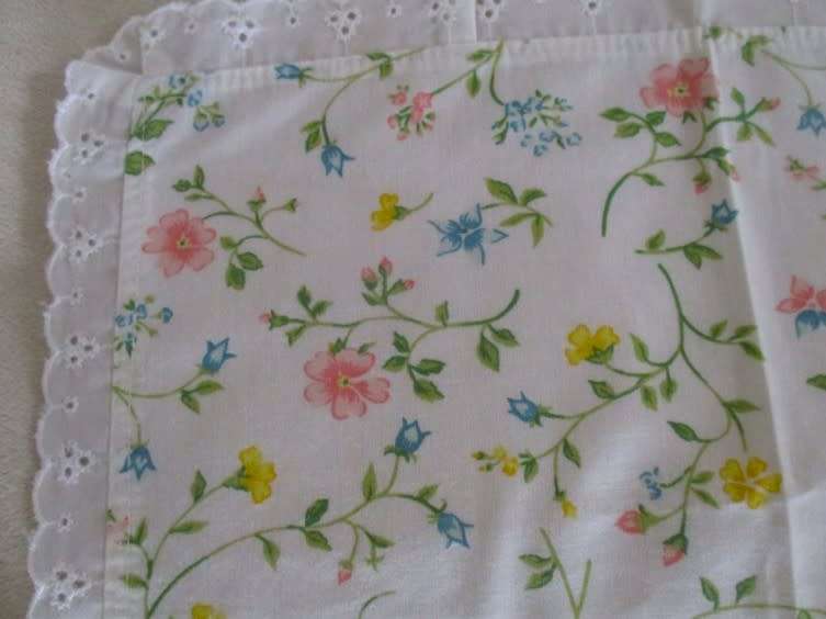 Eight pretty Laura Ashley-like floral cloths with lace borders