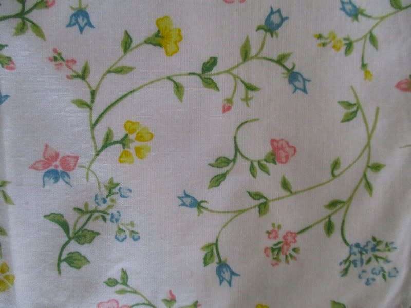 Eight pretty Laura Ashley-like floral cloths with lace borders