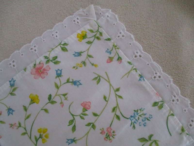 Eight pretty Laura Ashley-like floral cloths with lace borders