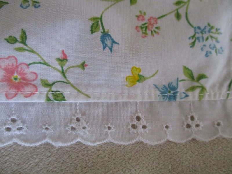 Eight pretty Laura Ashley-like floral cloths with lace borders