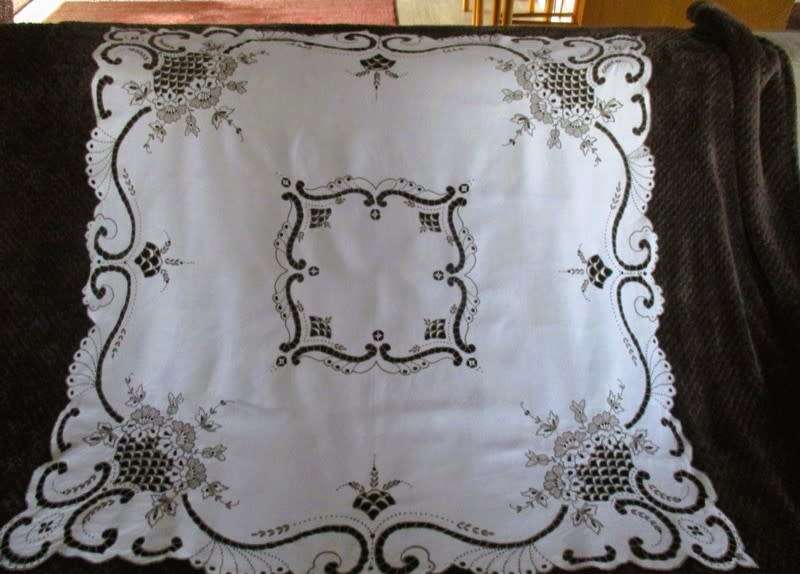 A medium-sized vintage cutwork embroidery cloth from Madeira with floral and butterfly wings detail