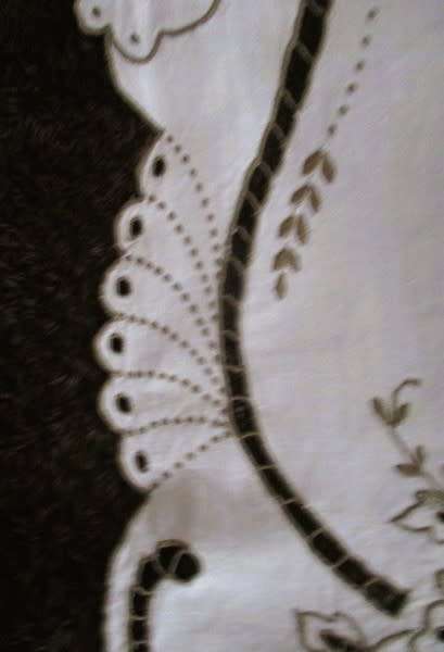 A medium-sized vintage cutwork embroidery cloth from Madeira with floral and butterfly wings detail