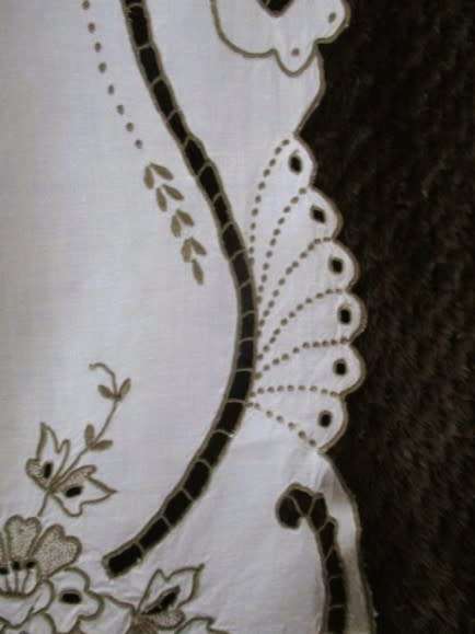 A medium-sized vintage cutwork embroidery cloth from Madeira with floral and butterfly wings detail