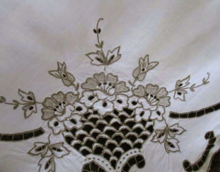 A medium-sized vintage cutwork embroidery cloth from Madeira with floral and butterfly wings detail