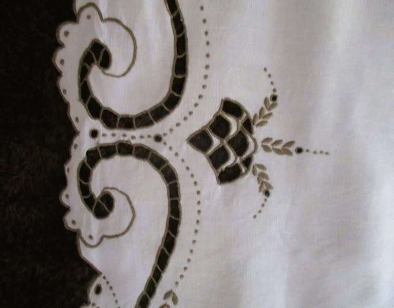 A medium-sized vintage cutwork embroidery cloth from Madeira with floral and butterfly wings detail