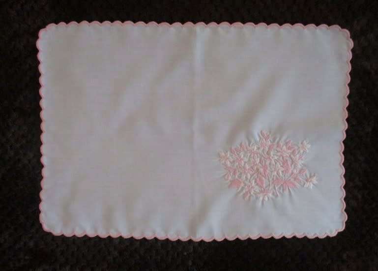 Two pretty white cloths embroidered with pink flowers
