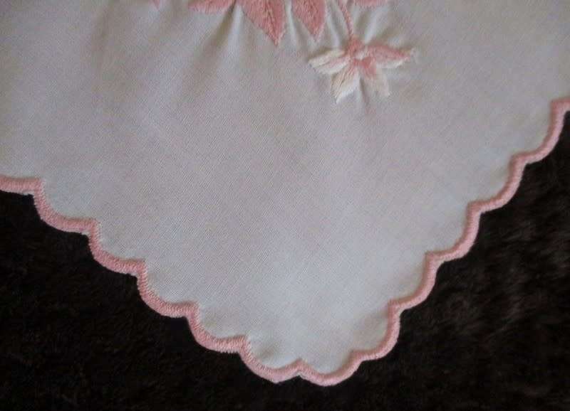 Two pretty white cloths embroidered with pink flowers