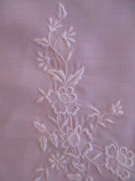 Two pretty pink cloths embroidered with white flowers