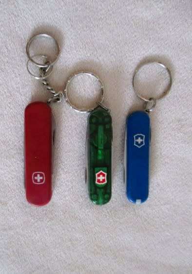 Three small vintage Victorinox Swiss Army Knives