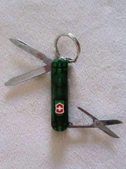 Three small vintage Victorinox Swiss Army Knives