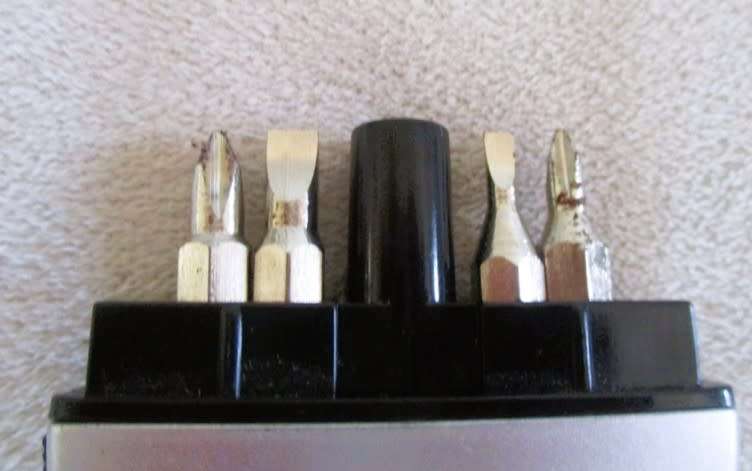 A lot of twelve interesting keyrings - perfume bottle, knife, mini tools, castanets etc