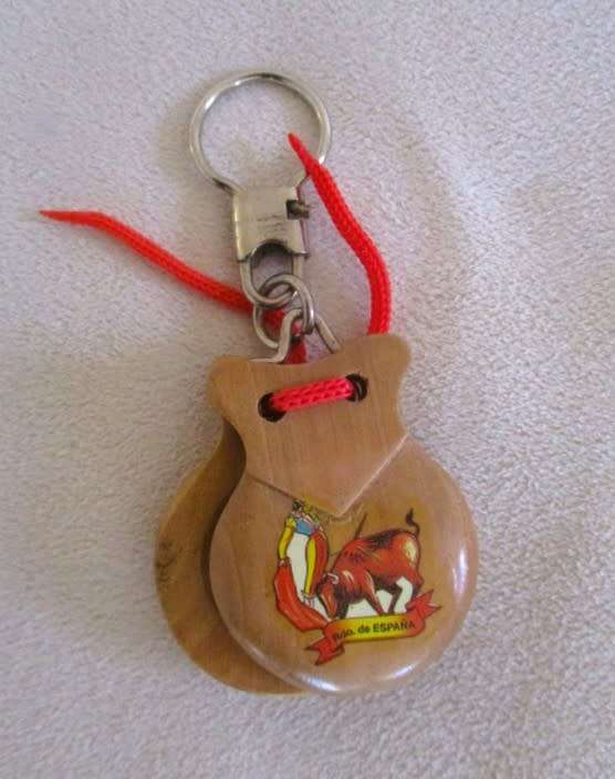 A lot of twelve interesting keyrings - perfume bottle, knife, mini tools, castanets etc