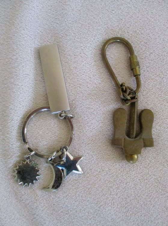 A lot of twelve interesting keyrings - perfume bottle, knife, mini tools, castanets etc