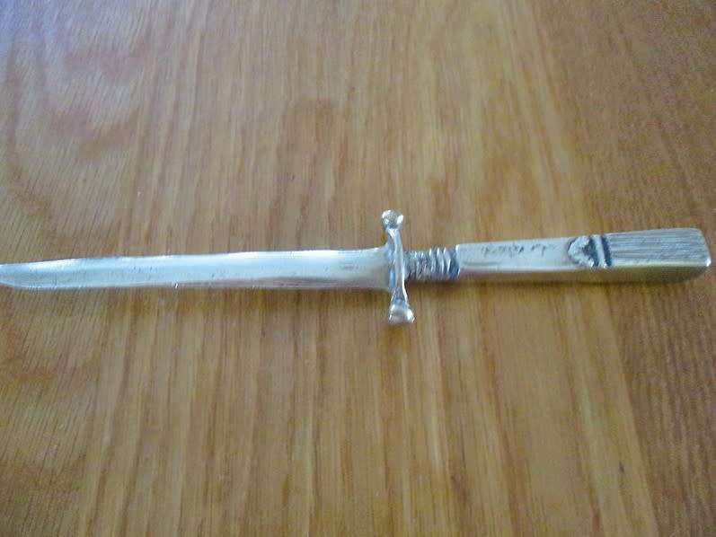 Vintage, ornate solid brass letter opener shaped like dagger