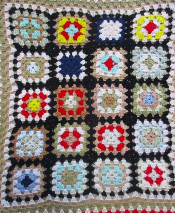 A hand crocheted wool blanket with soft colours - 190cm x 176cm