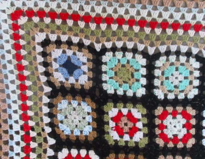 A hand crocheted wool blanket with soft colours - 190cm x 176cm