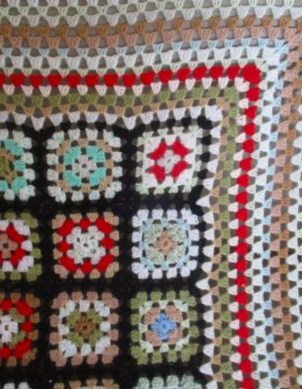 A hand crocheted wool blanket with soft colours - 190cm x 176cm