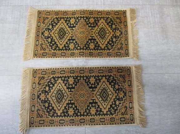 Two small Persian-style woven table mats