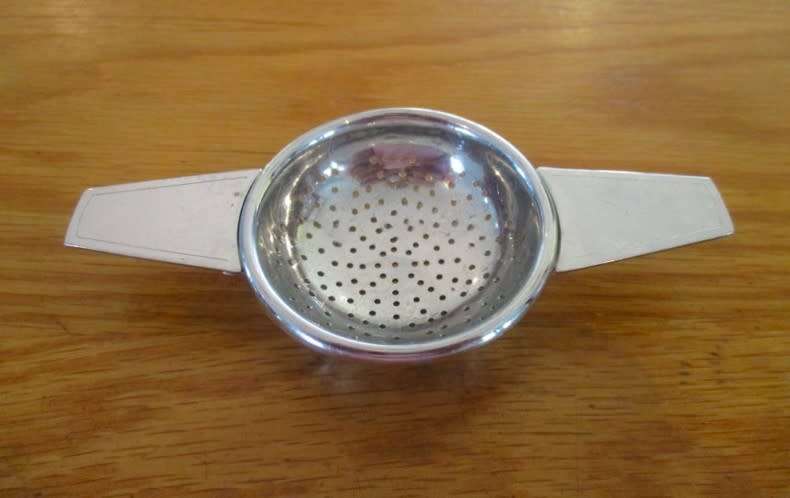 Midwinter, England tea strainer with porcelain base