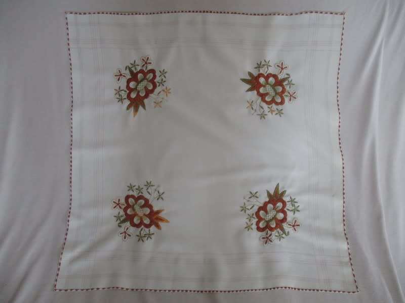 A smaller size square hand embroidered table cloth