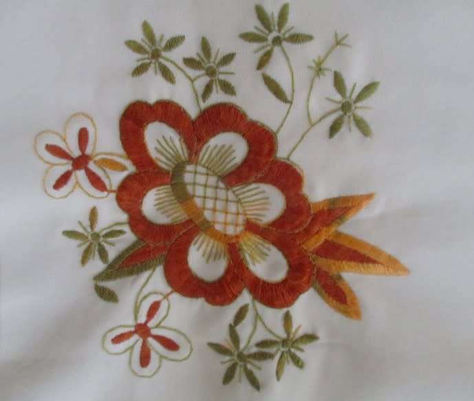 A smaller size square hand embroidered table cloth