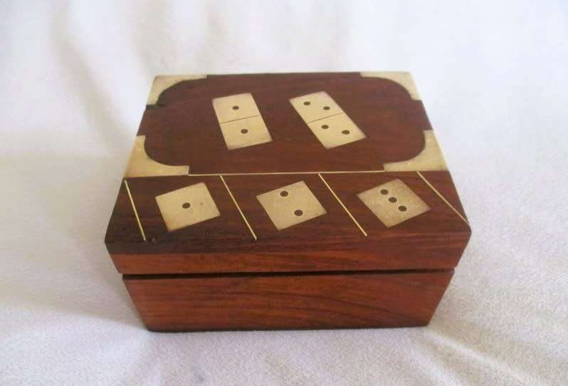 A very well made solid wood and brass domino set with four wooden die