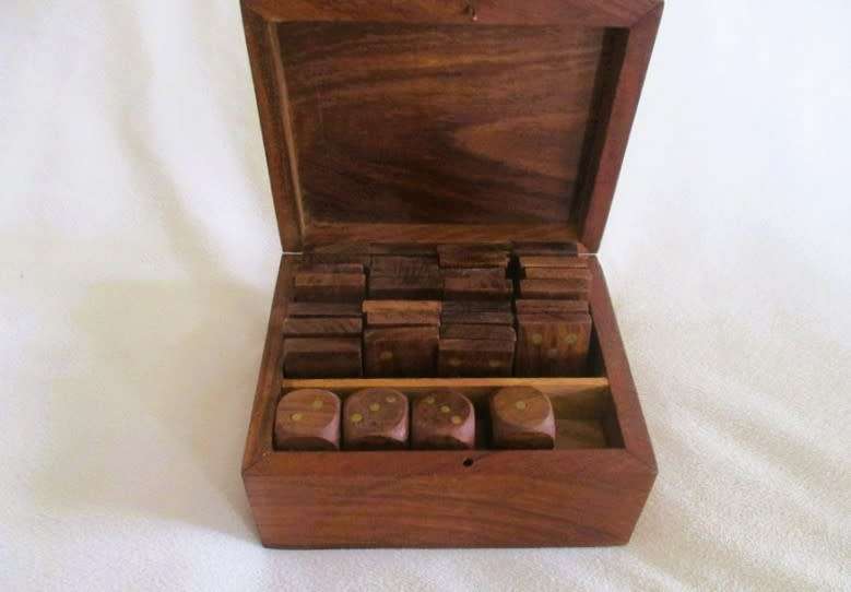 A very well made solid wood and brass domino set with four wooden die
