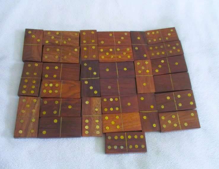 A very well made solid wood and brass domino set with four wooden die