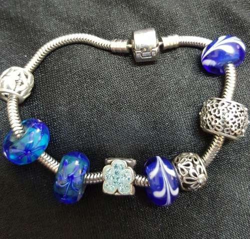 Beautiful  Silver  Braclete with Charms