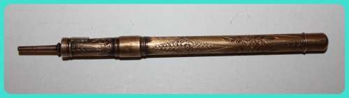 BEAUIFUL HAND ETCHED ITEM VERY OLD WITH INTRICATE DESIGN . I THINK IT IS A RETRACTABLE PENCIL