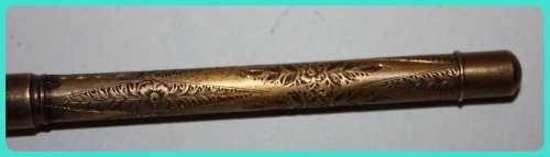 BEAUIFUL HAND ETCHED ITEM VERY OLD WITH INTRICATE DESIGN . I THINK IT IS A RETRACTABLE PENCIL
