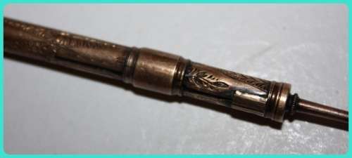 BEAUIFUL HAND ETCHED ITEM VERY OLD WITH INTRICATE DESIGN . I THINK IT IS A RETRACTABLE PENCIL