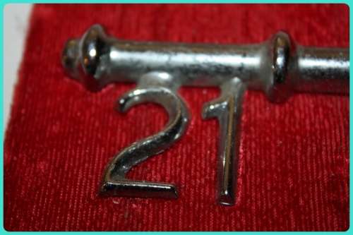 VINTAGE METAL 21 BIRTHDAY KEY ON RED BACK GROUND CAN BE REMOVED