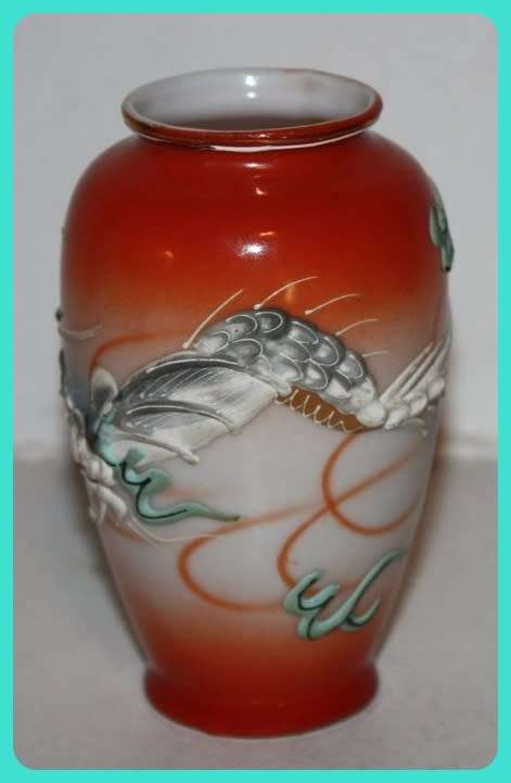 SMALL ORIENTAL POSY VASE WITH RAISED DESIGN OF A DRAGON