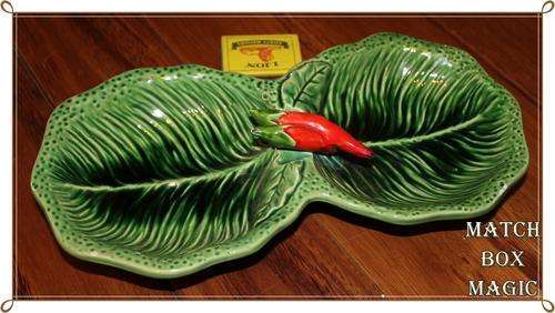 CABBAGE LEAF DISH WITH RED CHILI FINIAL