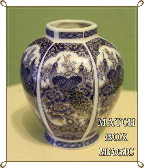 UNUSUAL SHAPED GINGER JAR BLUE WHITE WITH GOLD ACCENTS AND DECORATED WITH PEACOCKS